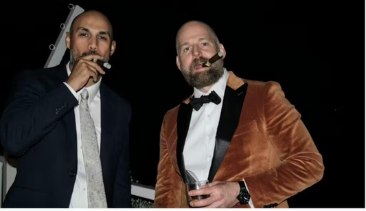 gentlemen in suits smoking cigars