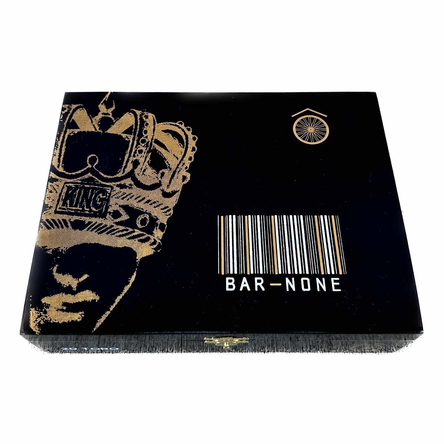 Black box with a stylized golden king illustration and a barcode labeled "BAR-NONE" on the front.