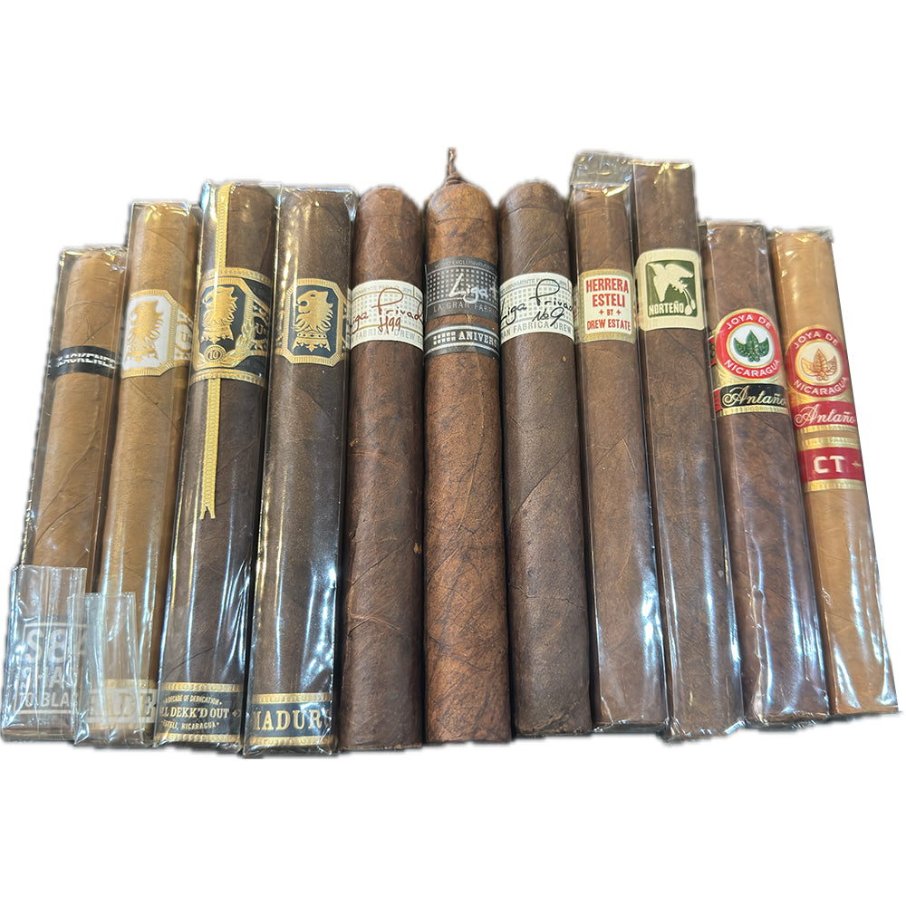 Assorted premium cigars in a row featuring different brands and packaging.