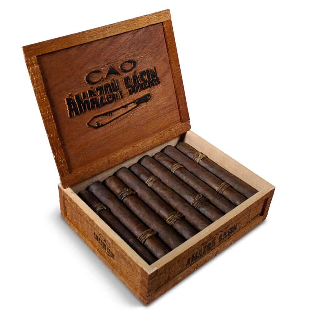 Open wooden box containing CAO Amazon Basin cigars with rustic appearance.