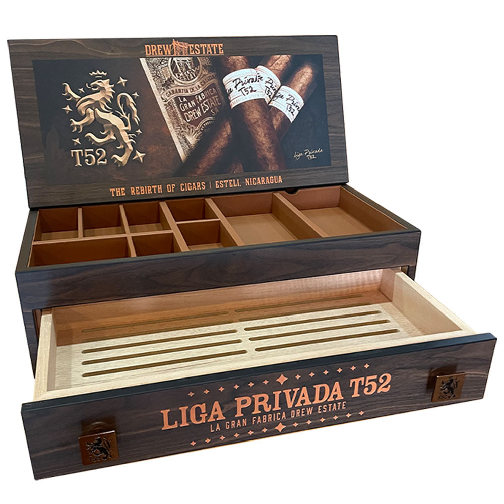 Wooden humidor box displaying Liga Privada T52 cigars with compartments and decorative motifs.