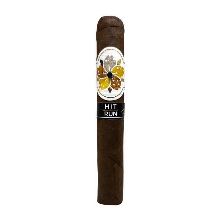 Dark brown cigar with a white and gold floral band, labeled "Hit and Run" against a white background.
