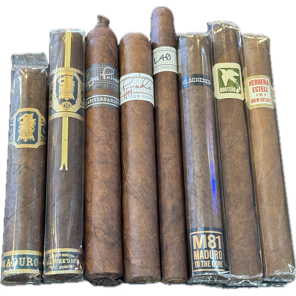Assorted Drew Estate cigars in packaging, featuring various labels and designs.