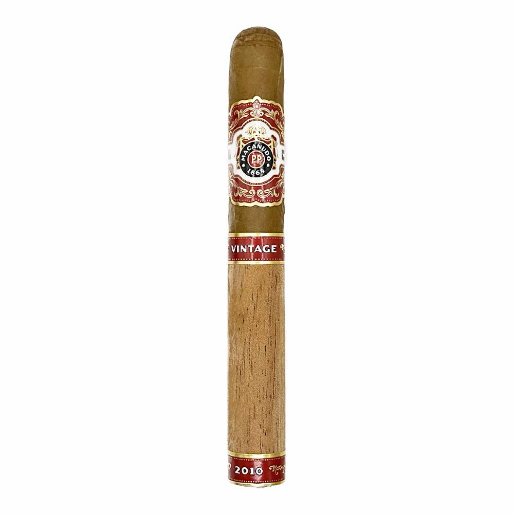 Premium cigar with decorative red and gold label featuring vintage design.
