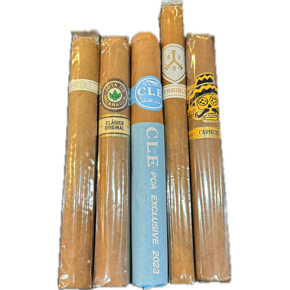 Five assorted cigars standing vertically, featuring various labels and packaging designs.