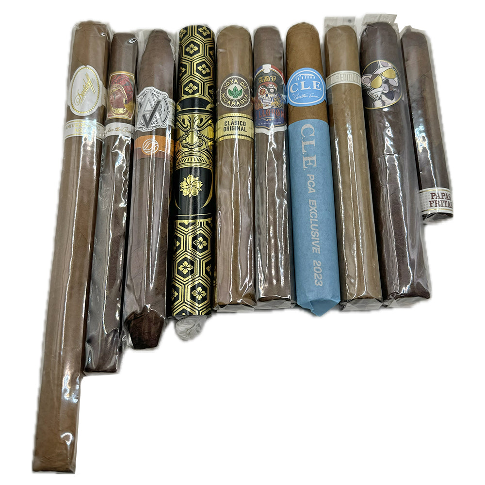 A collection of premium cigars with various labels and wrappers, showcasing different brands and styles arranged in a row.