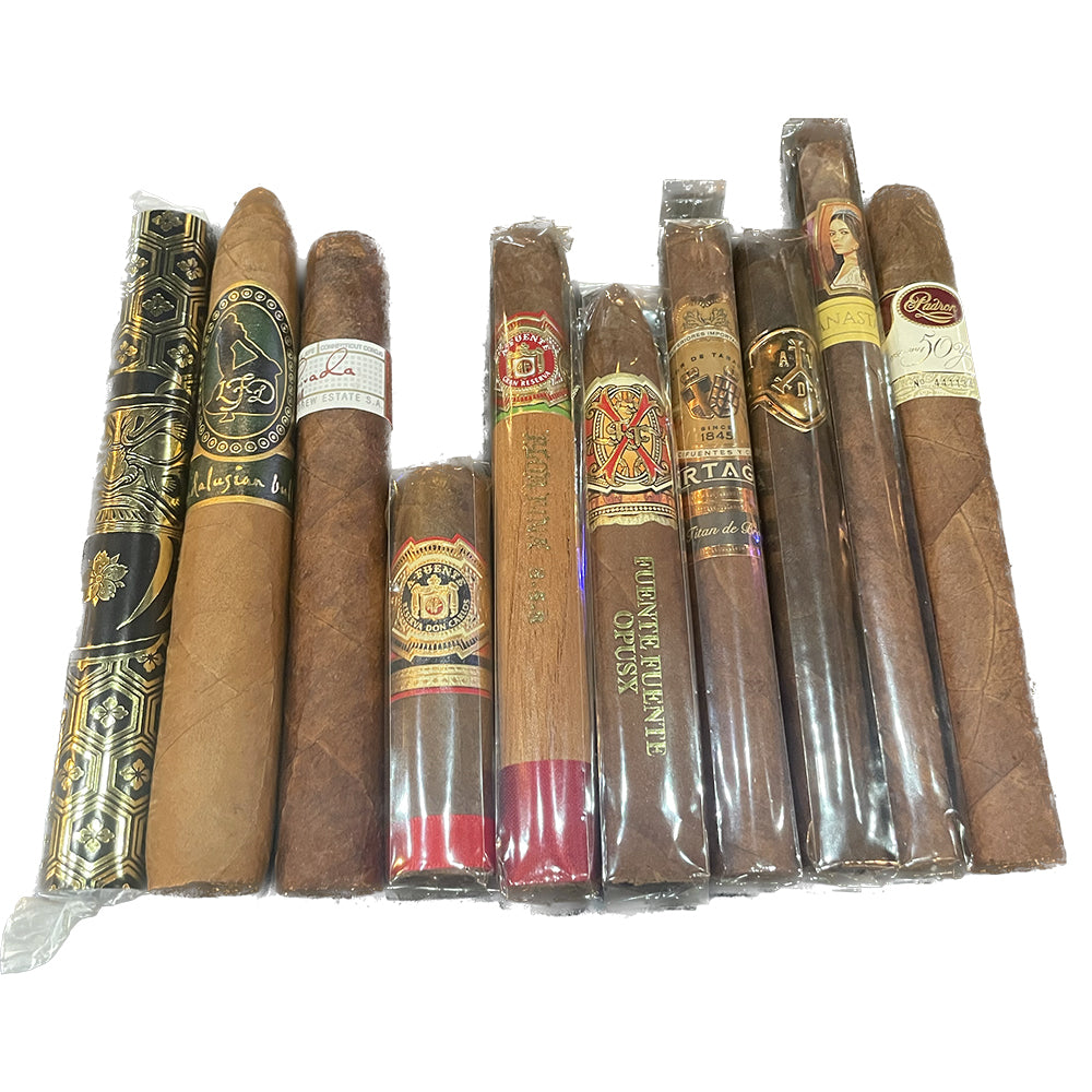Assorted collection of premium cigars in various wrappers and bands arranged side by side.