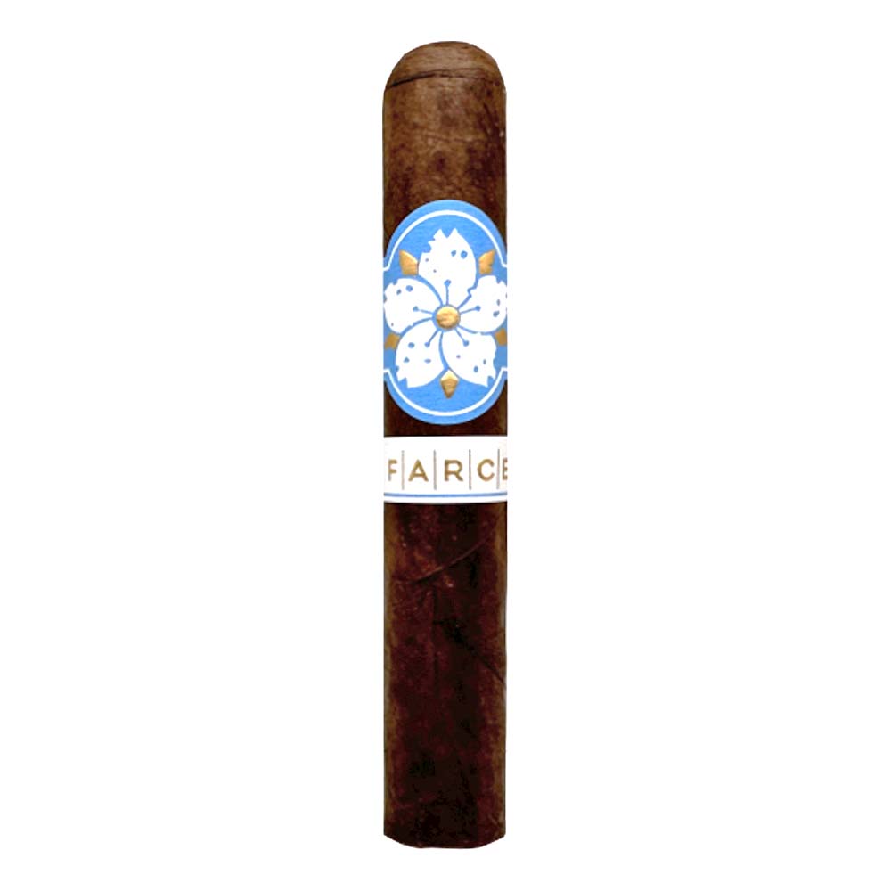 Premium Farce cigar with intricate floral band design on blue background.