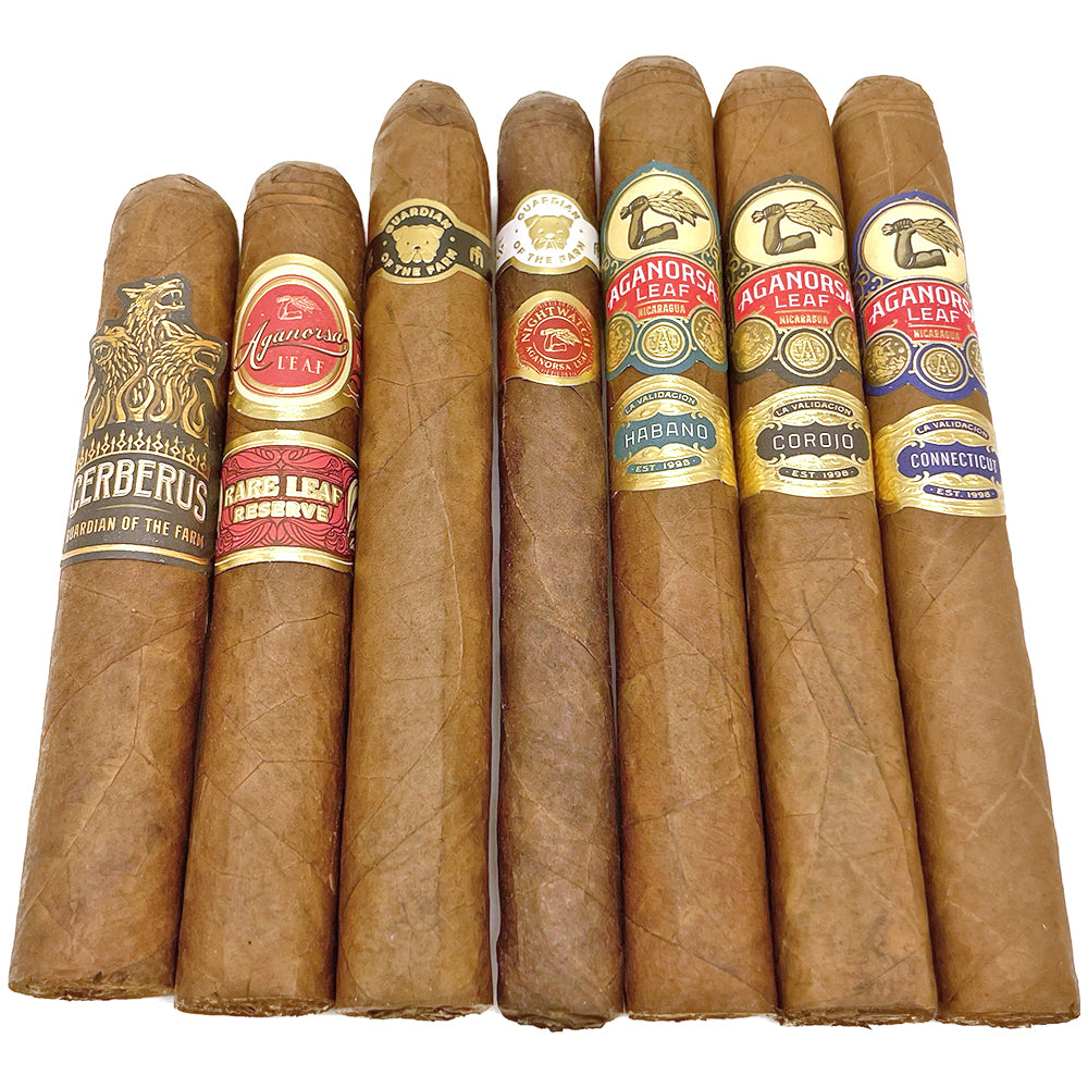 Assorted Aganorsa Leaf cigars with different labels and wrappers arranged in a row.