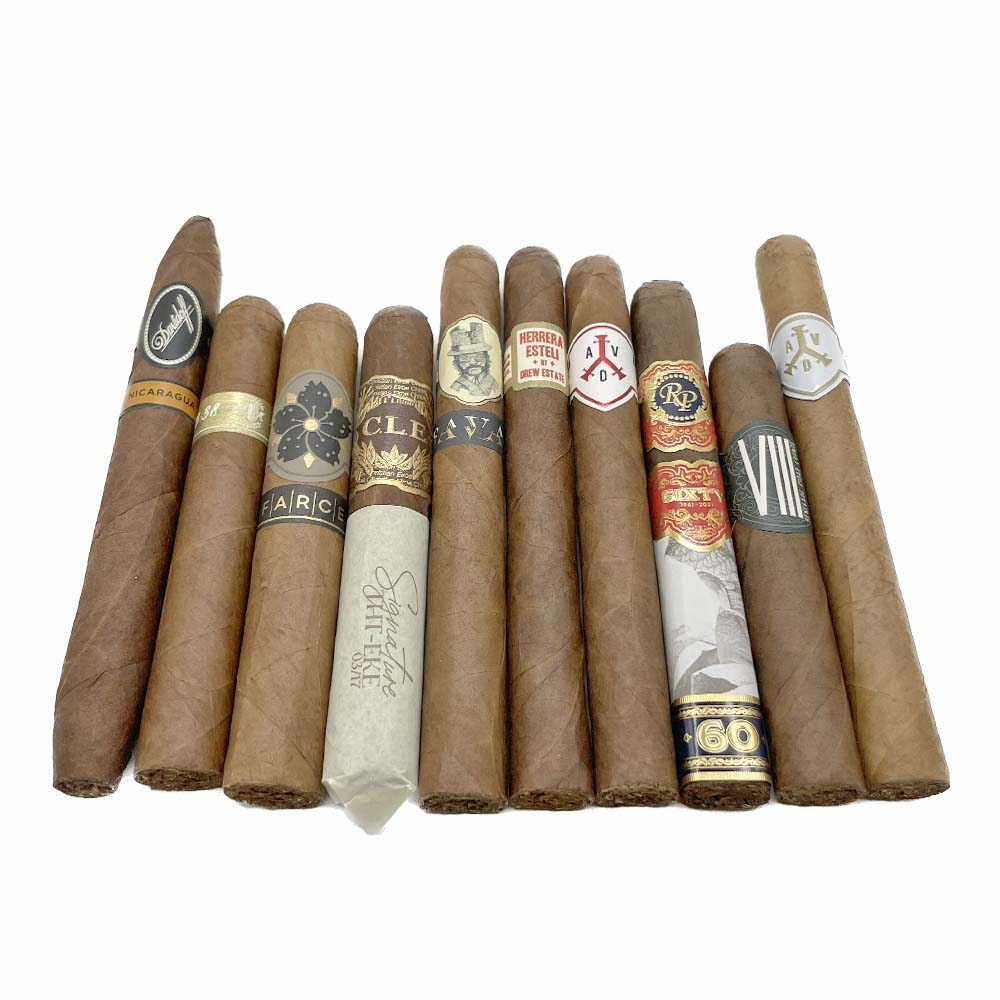 Various premium cigars in a row, showcasing different labels and bands, highlighting luxury tobacco products.