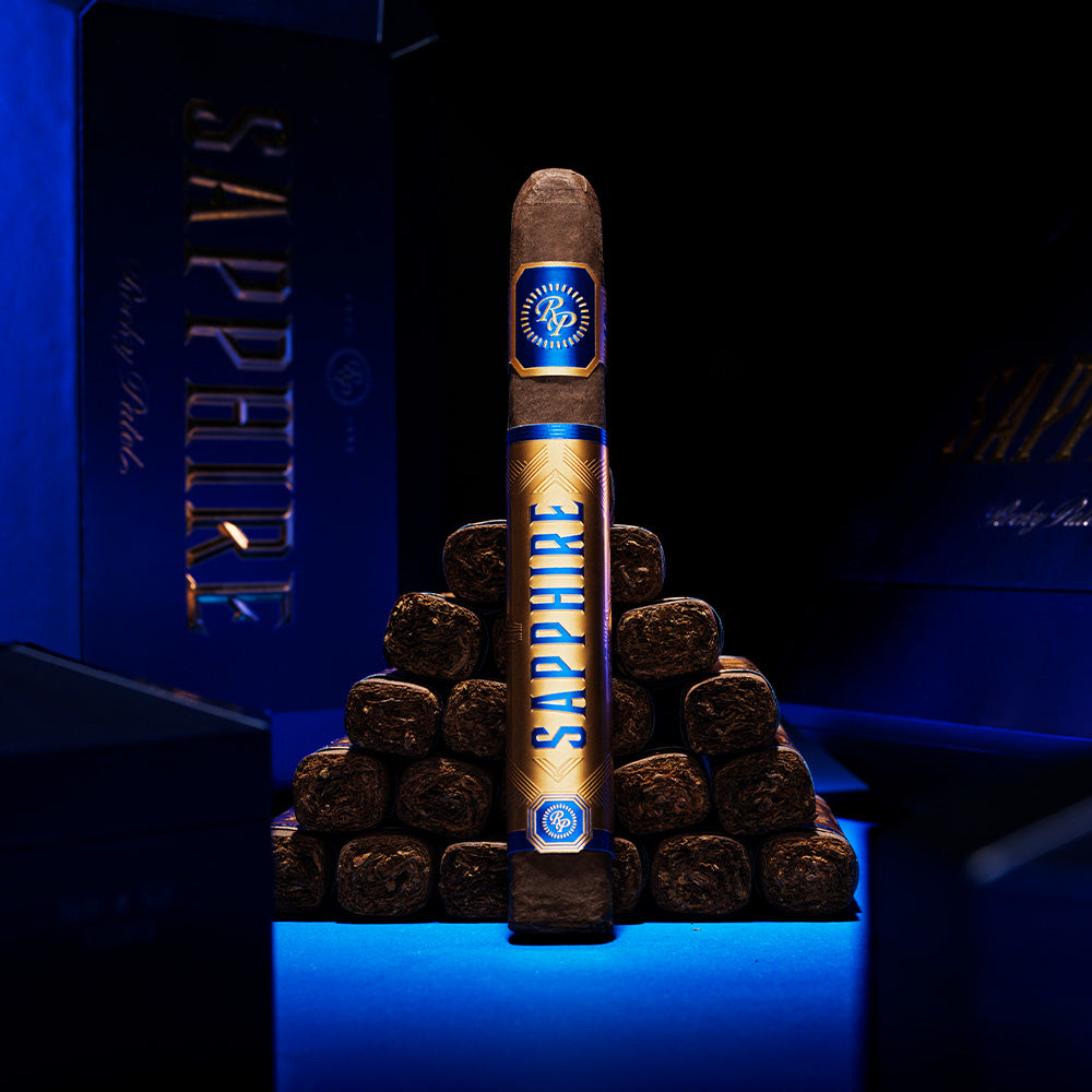 Rocky Patel Sapphire cigar upright, showing the wrapper and band