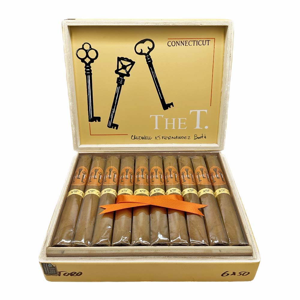 Box of The T Connecticut cigars, featuring Caldwell, A.J. Fernandez, and Booth branding, with an open lid revealing neatly arranged cigars inside.